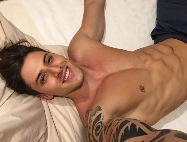 Naturally a brunette, Danilo Borgato poses for an Instagram photo in bed.