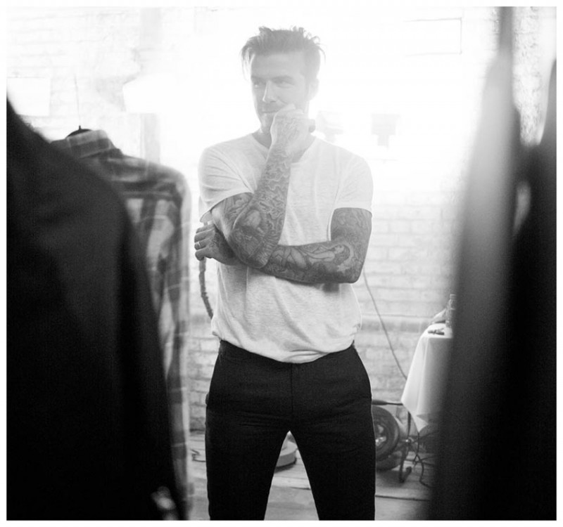 David Beckham is captured in a black & white candid as he wears a simple t-shirt with a pair of trousers.