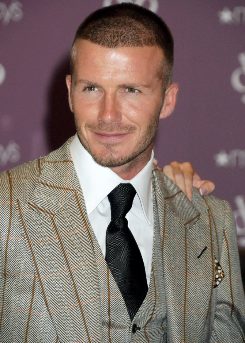 David Beckham sports a buzz cut hair style. 