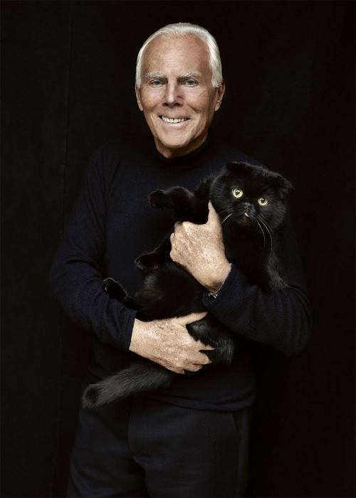 Designer Giorgio Armani photographed by François Dischinger with his black cat Angel.