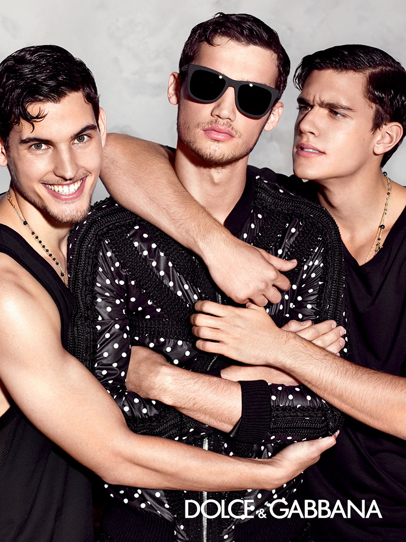 Three's Company: Clad in black Dolce & Gabbana fashions, Travis Cannata, Misa Patinszki and Xavier Serrano cheese it up for a fun campaign photo.