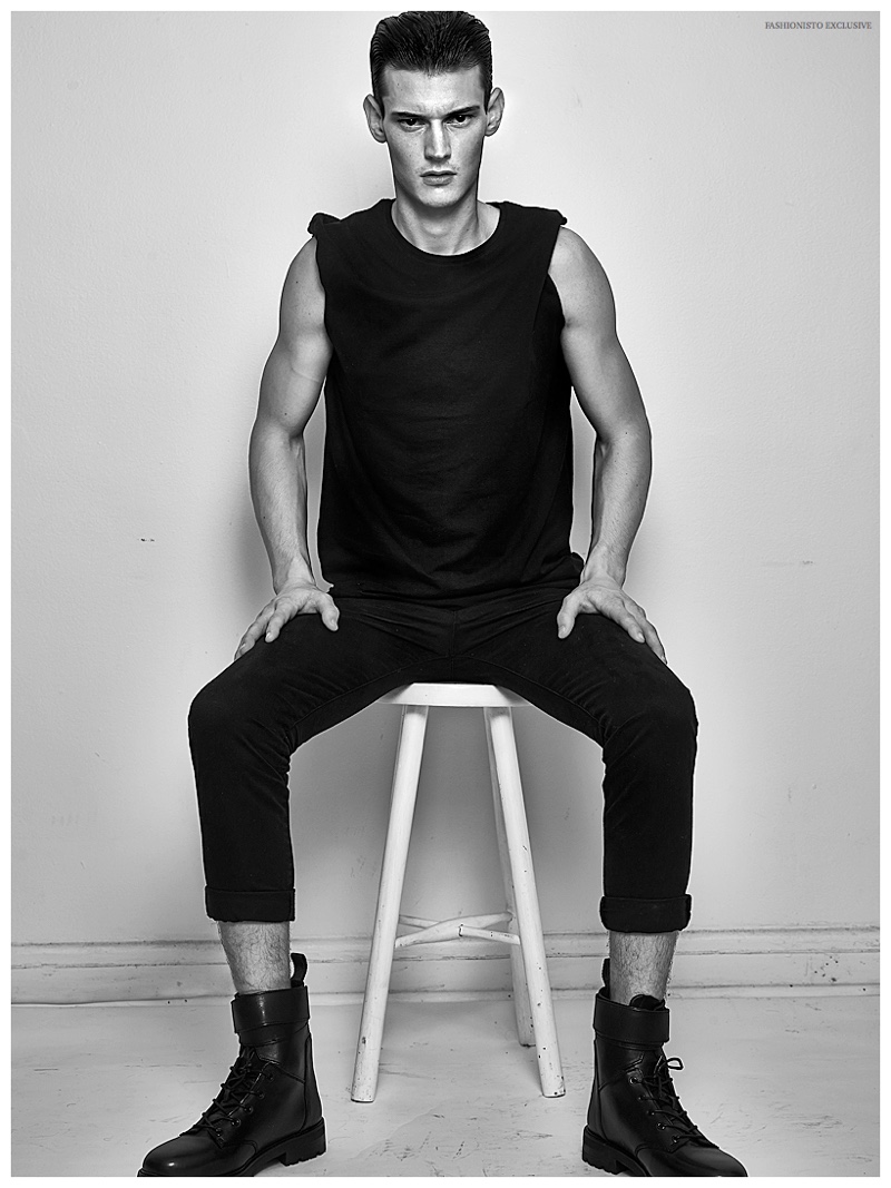 Adam Butcher wears t-shirt Dolce & Gabbana, pants Ralph Lauren and boots H&M.