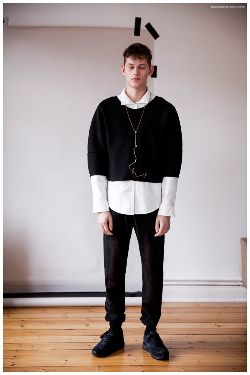 Christopher wears necklace Mads Dinesen, socks Falke, shoes NIKE, pants, pullover and cream shirt Vektor.
