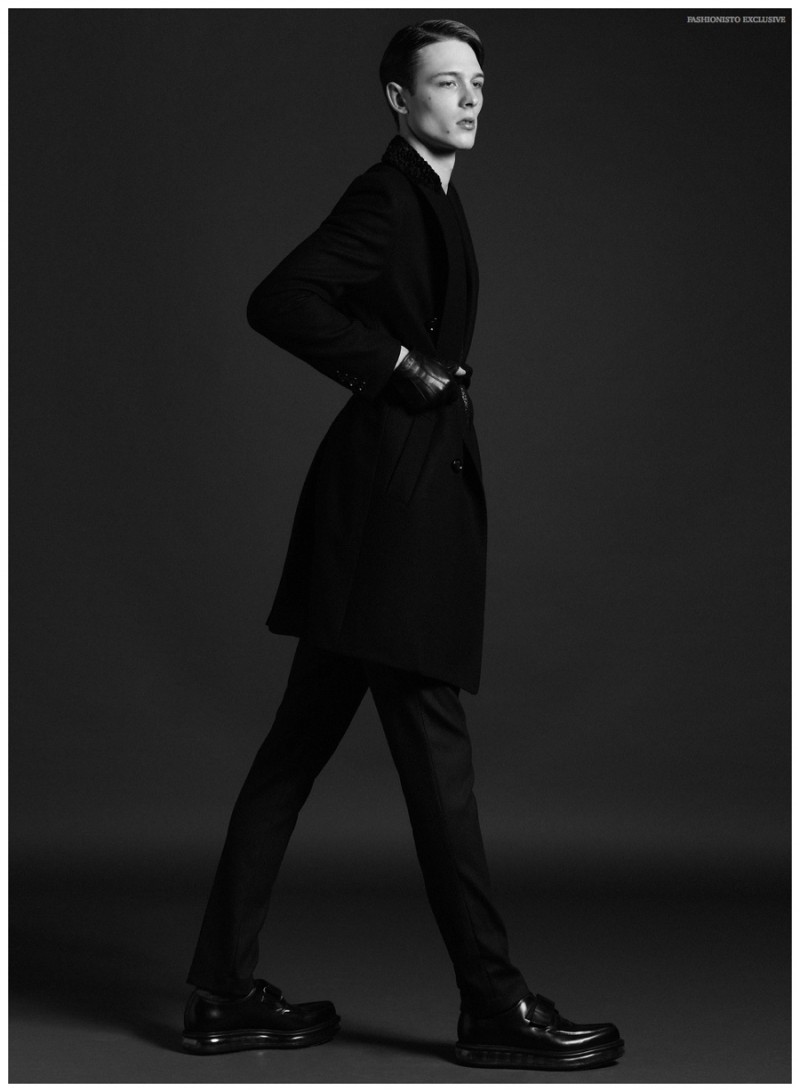 David wears coat Zara, trousers Calvin Klein, shoes Prada and gloves H&M.