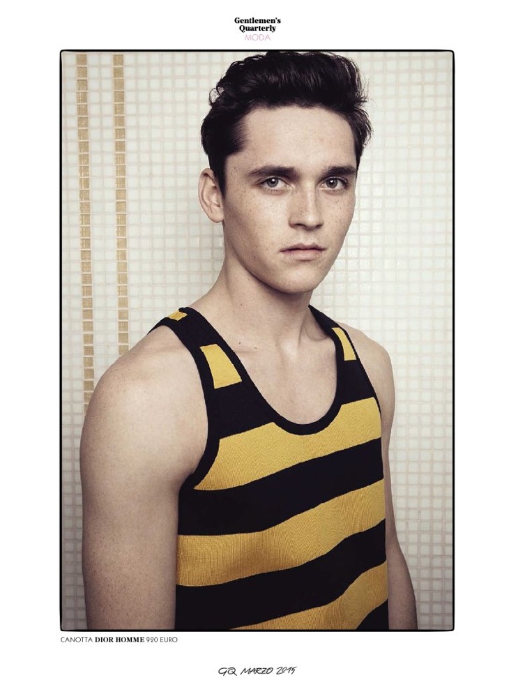 Anders Hayward models a yellow and black striped tank from Dior Homme.