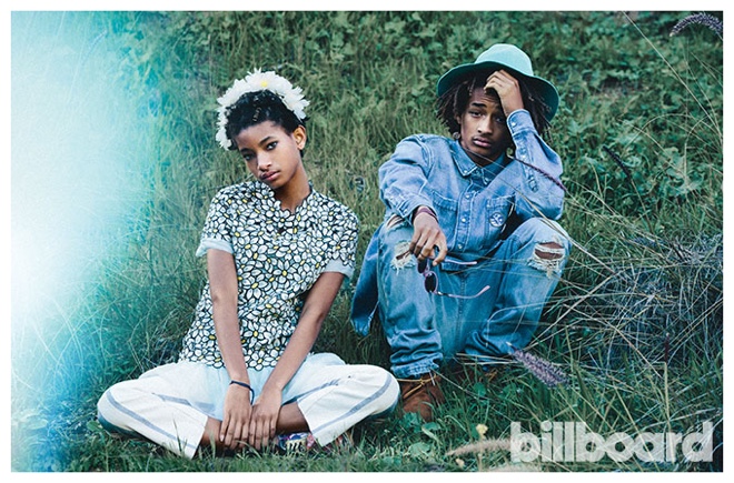 Posing for a picture with his sister Willow, Jaden Smith wears Burberry Prorsum hat, Minnetonka boots, 3.1 Phillip Lim x Linda Farrow sunglasses, AMI denim shirt and jeans.