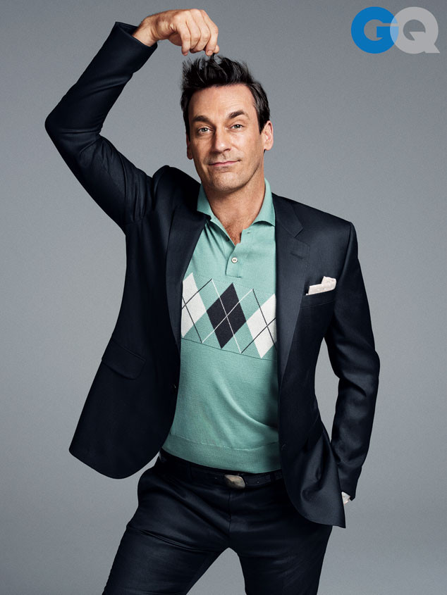 Posing for a new photo shoot, Jon Hamm wears an argyle print polo shirt with a trim suit.