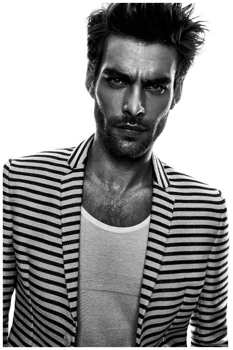 Jon Kortajarena goes nautical in a striped jacket with a simple white tee.