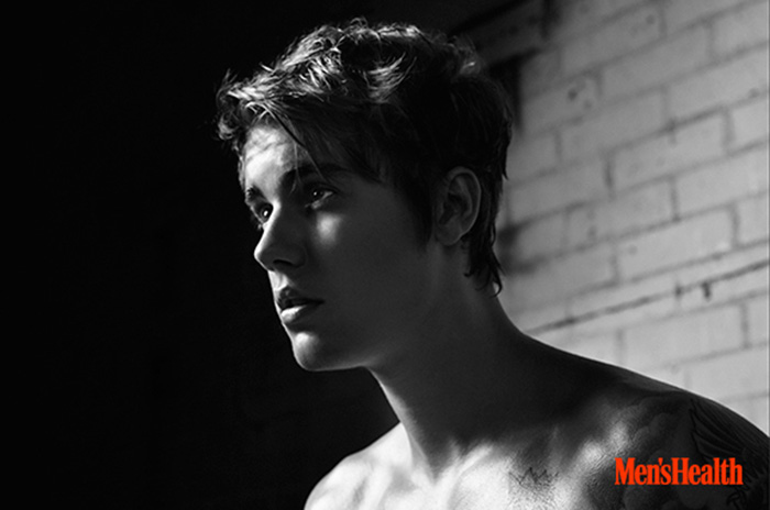 Justin Bieber poses for a black & white portrait.