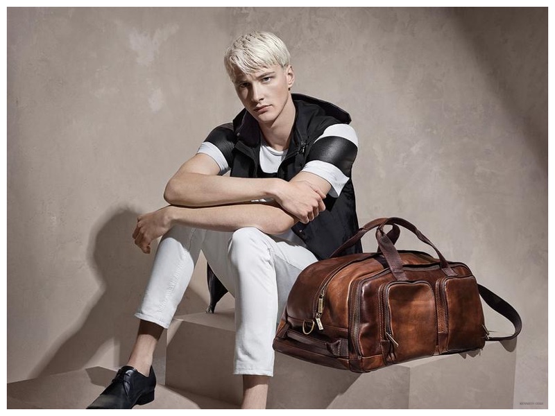 Showing off a sporty edge from Kenneth Cole, Benjamin Jarvis rocks a sleeveless hoodie with white jeans.