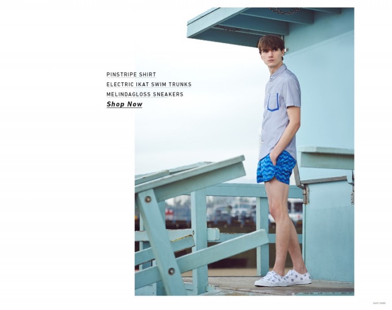 Gryphon O'Shea has a blue moment in Marc by Marc Jacobs swim shorts and a pinstripe shirt.