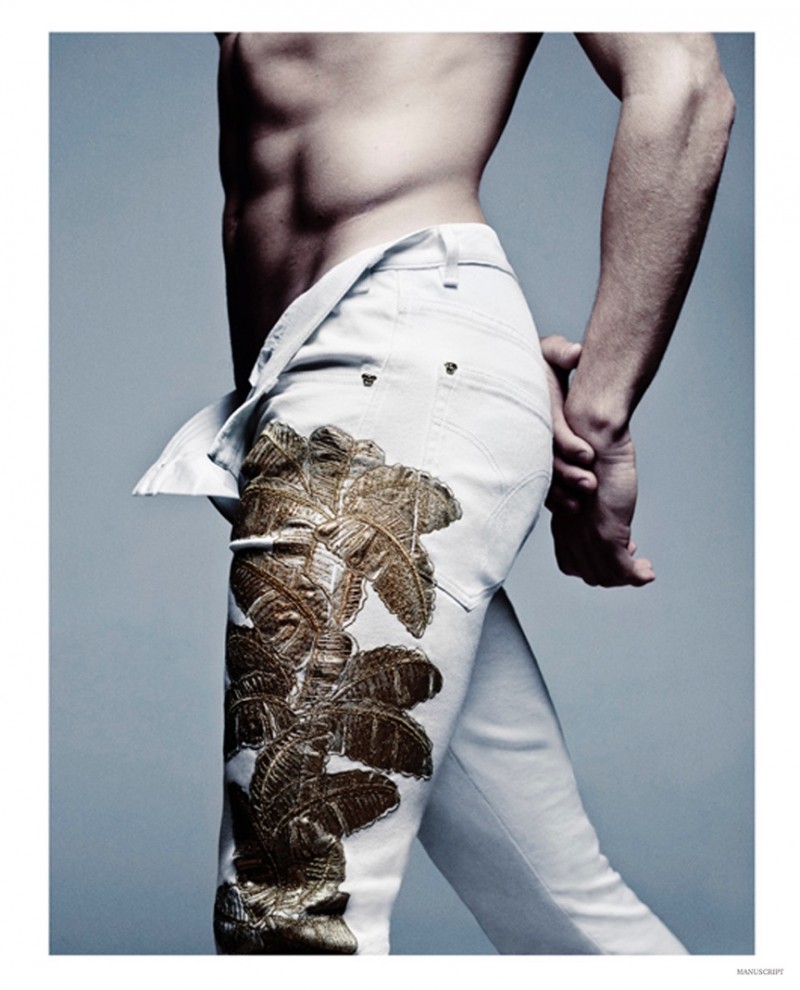 A close-up of Mariano Ontañon offers a look at Versace's decadent, embellished white pants.
