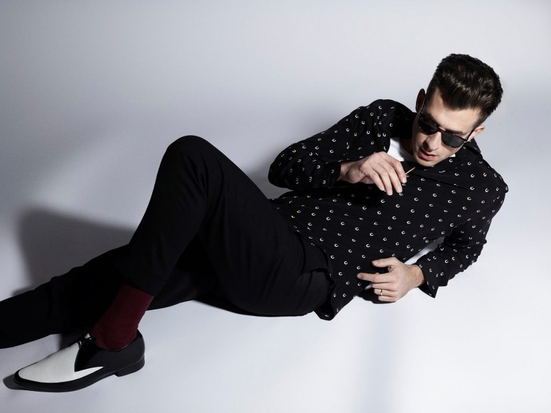 Mark Ronson poses for a chic studio photo.