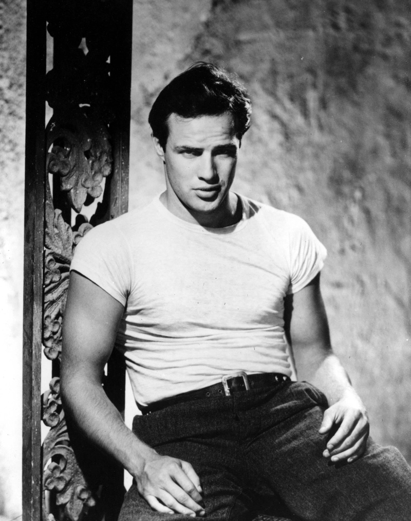 Marlon Brando portrays Stanley Kowalski, wearing his iconic fitted short-sleeve white t-shirt in 1951's "A Streetcar Named Desire."