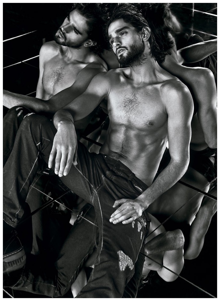 Going for an edgy denim look, Marlon Teixeira poses for a shirtless black & white image.
