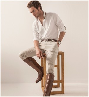 Model Justice Joslin wears leather riding boots as part of Massimo Dutti's equestrian collection.
