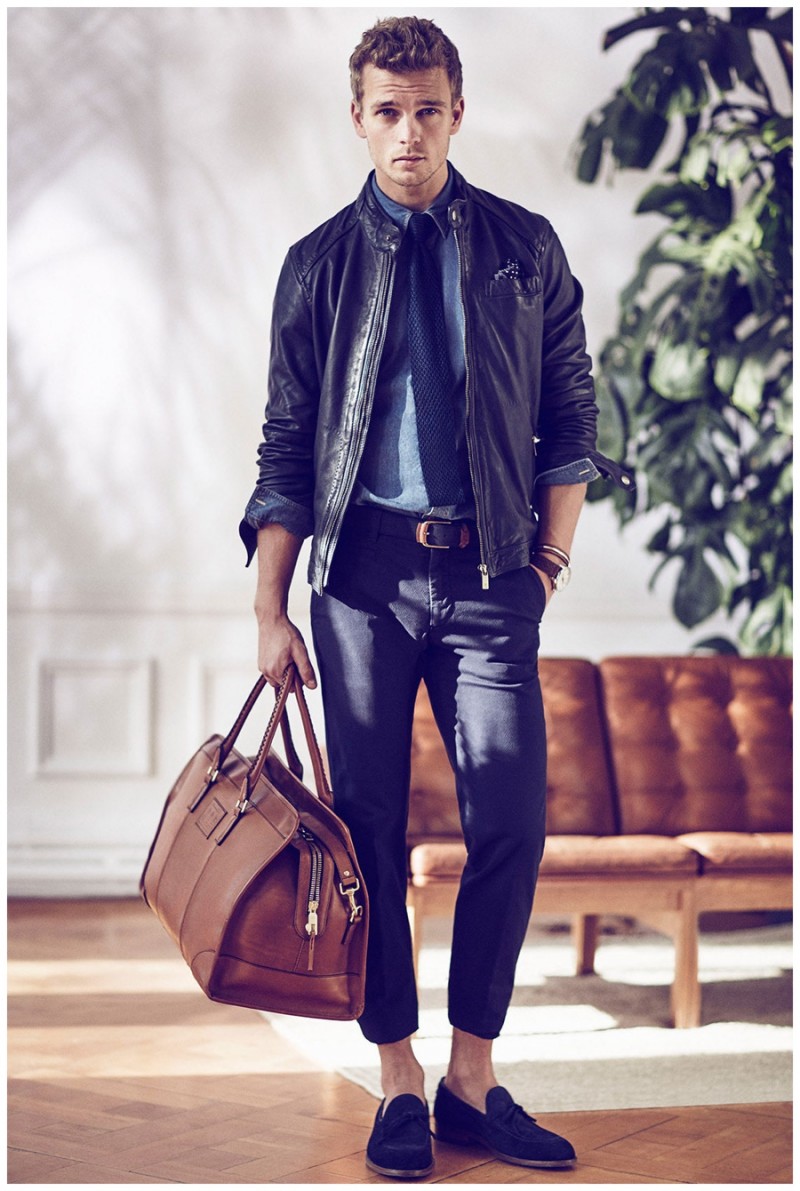 Benjamin Eidem carries one of Massimo Dutti's luxe leather bags.