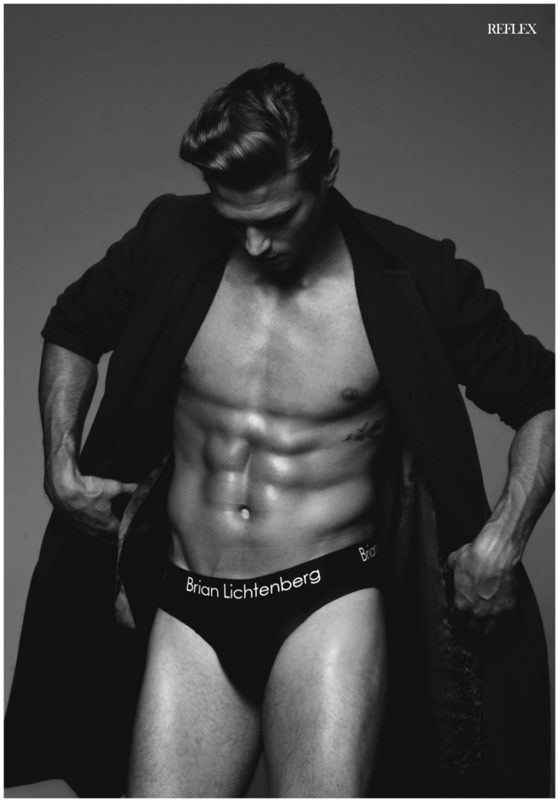 Matthew Noszka models underwear from Brian Litchenberg with a Marks & Spencer coat.