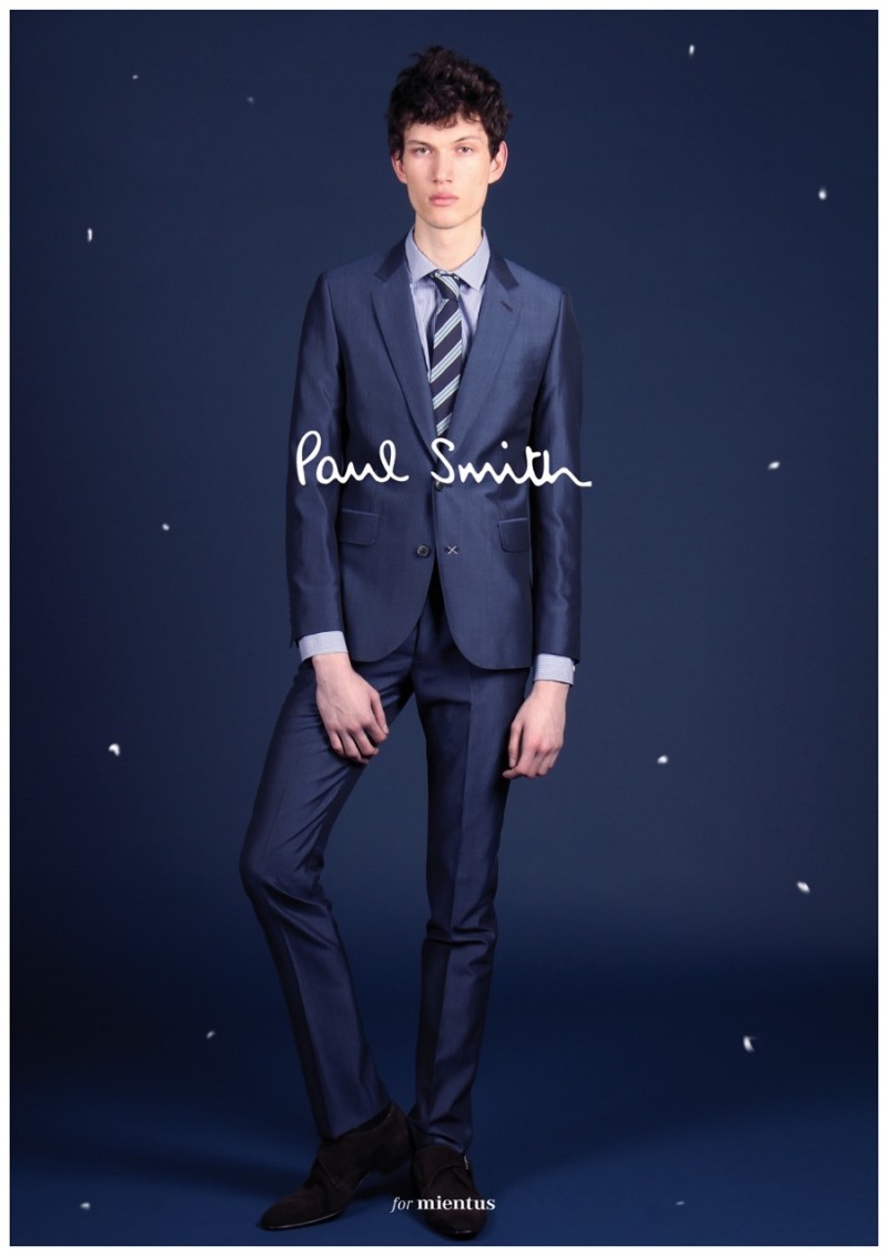 Lukas Ziegele looks sharp in a navy suit from British designer Paul Smith.