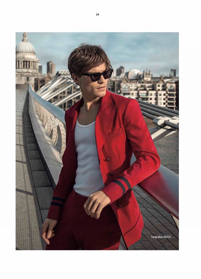 Oliver Cheshire plays it cool in a red Gucci suit.