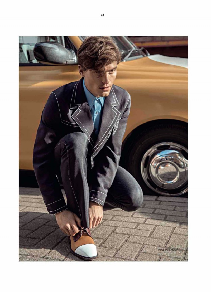 Oliver Cheshire sports a Prada suit.