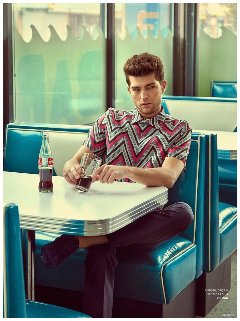 Enjoying soda pop, Paolo Anchisi wears a zigzag print shirt from Louis Vuitton.