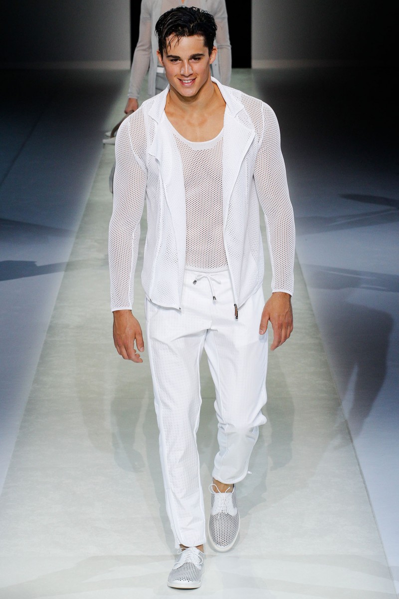 A vision in white, Pietro Boselli walks for Emporio Armani's spring-summer 2014 show.