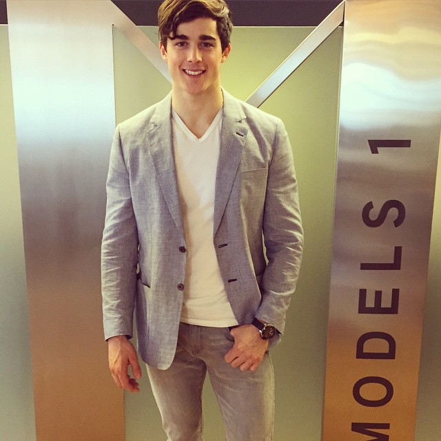 Pietro Boselli is all smiles as he stops by his London modeling agency Models 1.