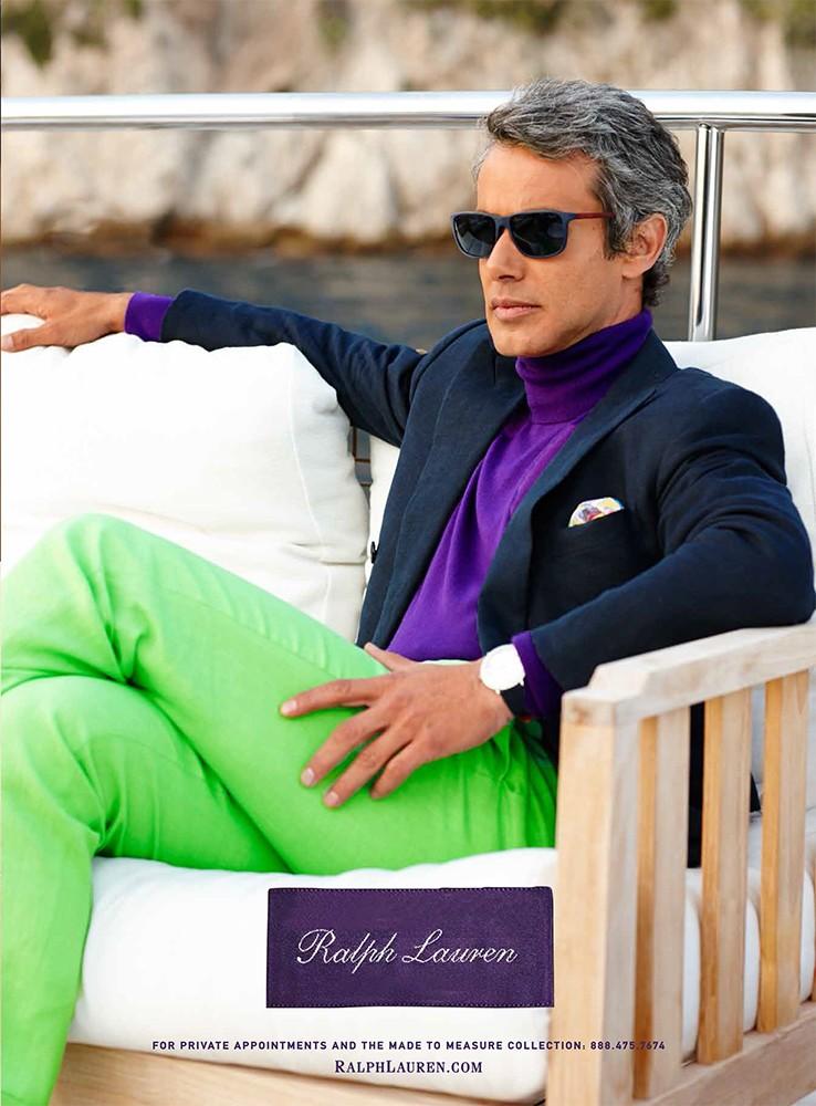Going for a bright style moment, Andrew Lauren sports acid green pants with a rich purple turtleneck. 