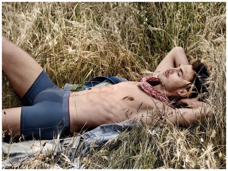 Relaxing in a field, Jabel Balbuena is comfortable in blue Replay underwear.