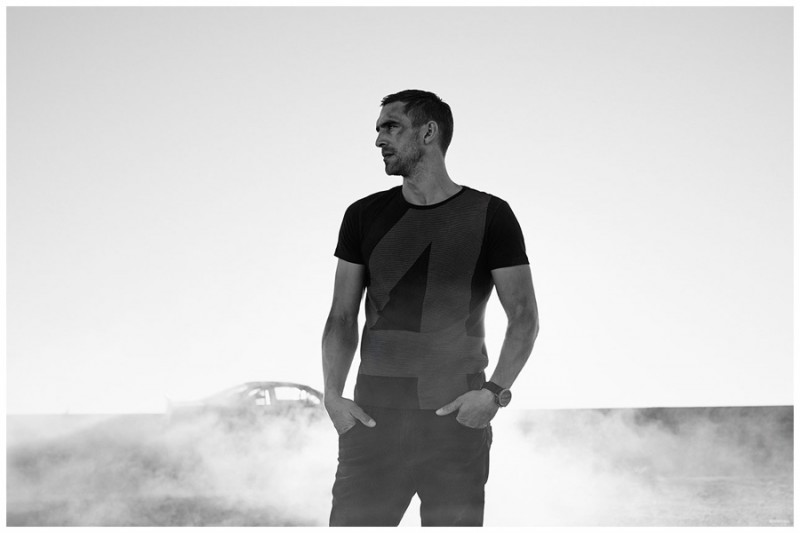 Captured in a black & white photo, Will Chalker is casual in a graphic t-shirt.