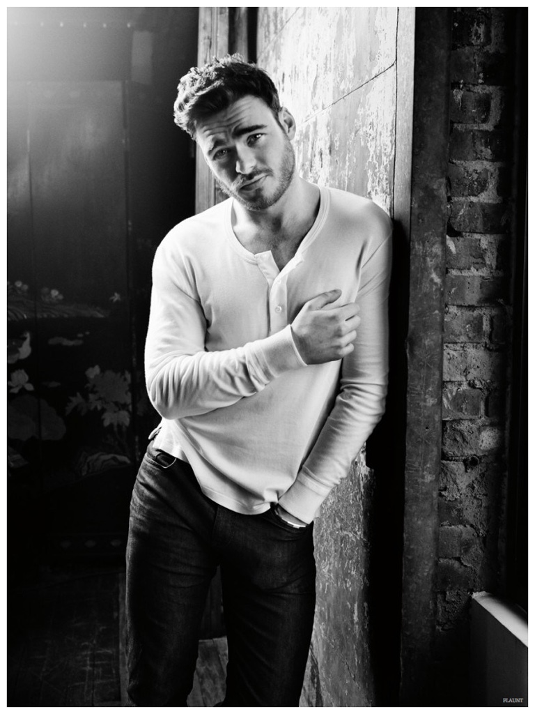 Richard Madden relaxes in a black & white shot from his Flaunt photo shoot.