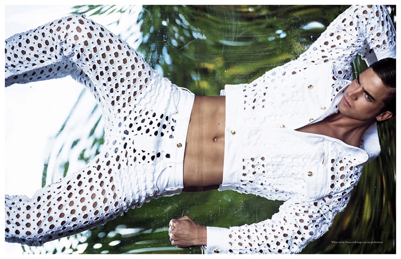 River Viiperi wears a white cut-out look from Versace.