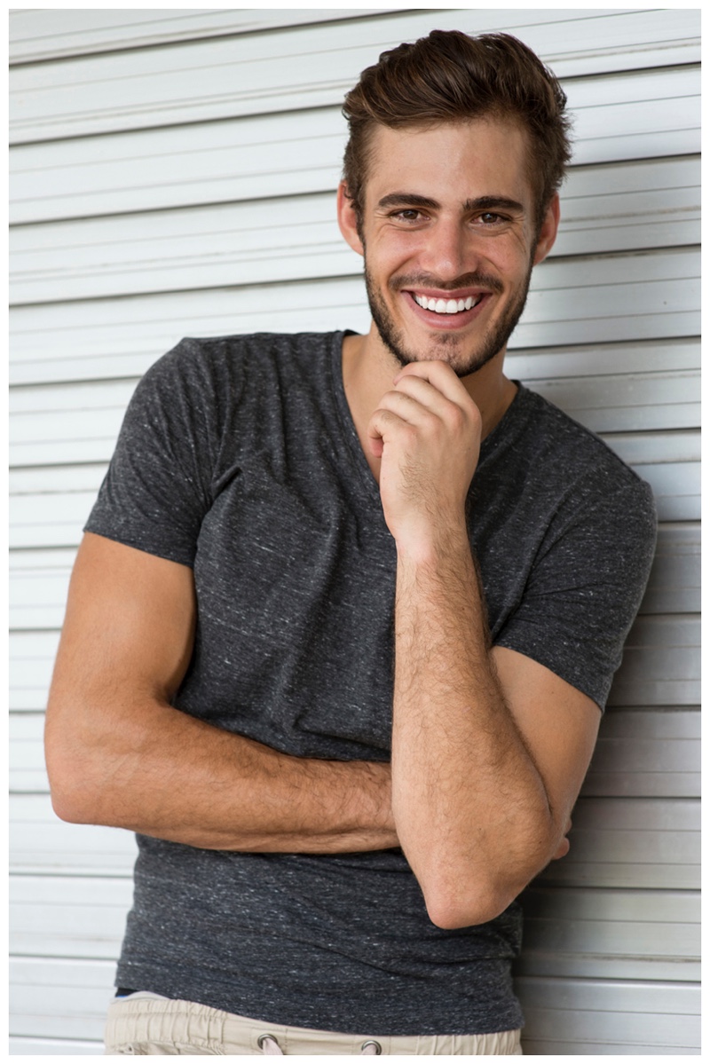 Roelof Theunissen is all smile in a simple gray v-neck.