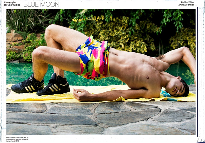 Ryan Bertroche poses in Dsquared2 camouflage shorts with Adidas sneakers.