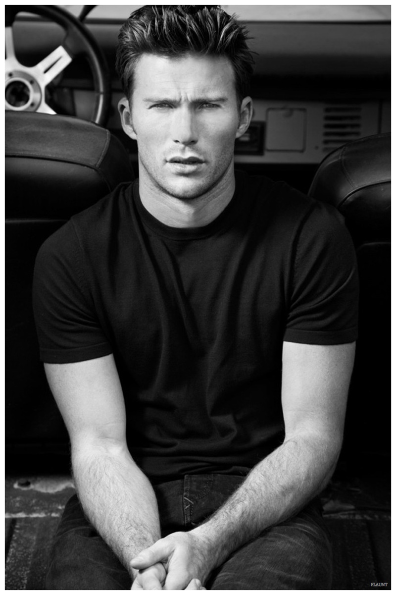 Relaxed, Scott Eastwood wears a Michael Kors tee with J Brand jeans.