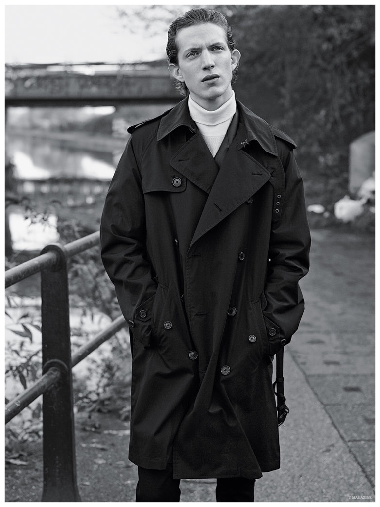 Xavier Buestel delivers a contemplative expression as he models an oversized trench from Ralph Lauren Purple Label.