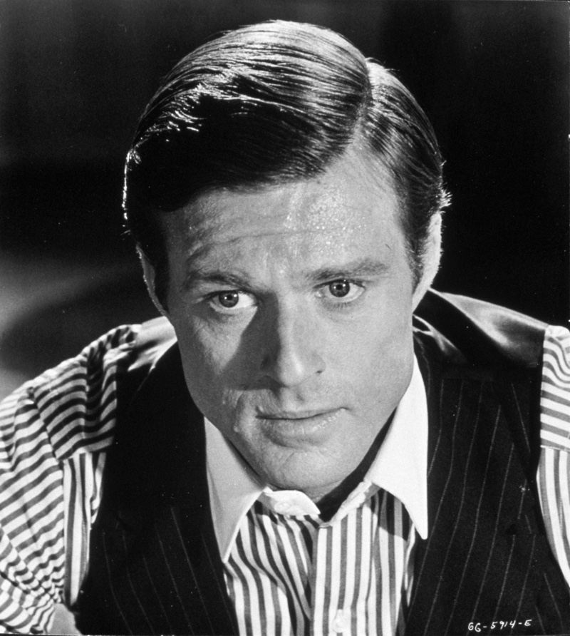 Hollywood legend Robert Redford wears a striped shirt with a pinstripe waistcoat as Jay Gatsby in The Great Gatsby (1974). » 1920s Men's Fashion Guide: Style of the Roaring Decade Hollywood legend Robert Redford wears a striped shirt with a pinstripe waistcoat as Jay Gatsby in The Great Gatsby (1974).
