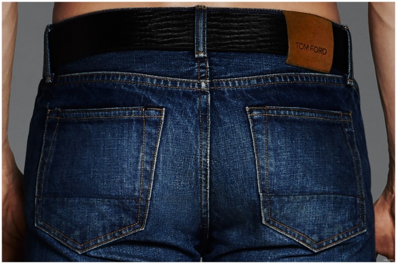 Detailed shot of the back of Tom Ford's denim jeans.