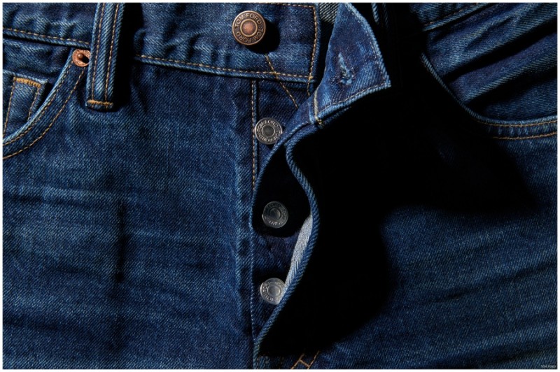 Detailed shot of Tom Ford's denim jeans' button fly.