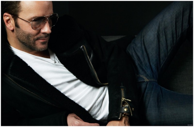 Tom Ford models a pair of his own denim jeans.