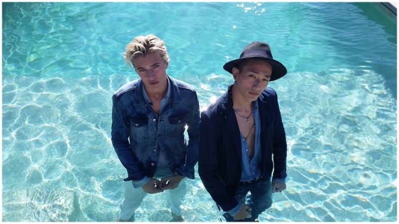 Lucky Blue Smith and Sung Jin Park pose for a photo in the pool.