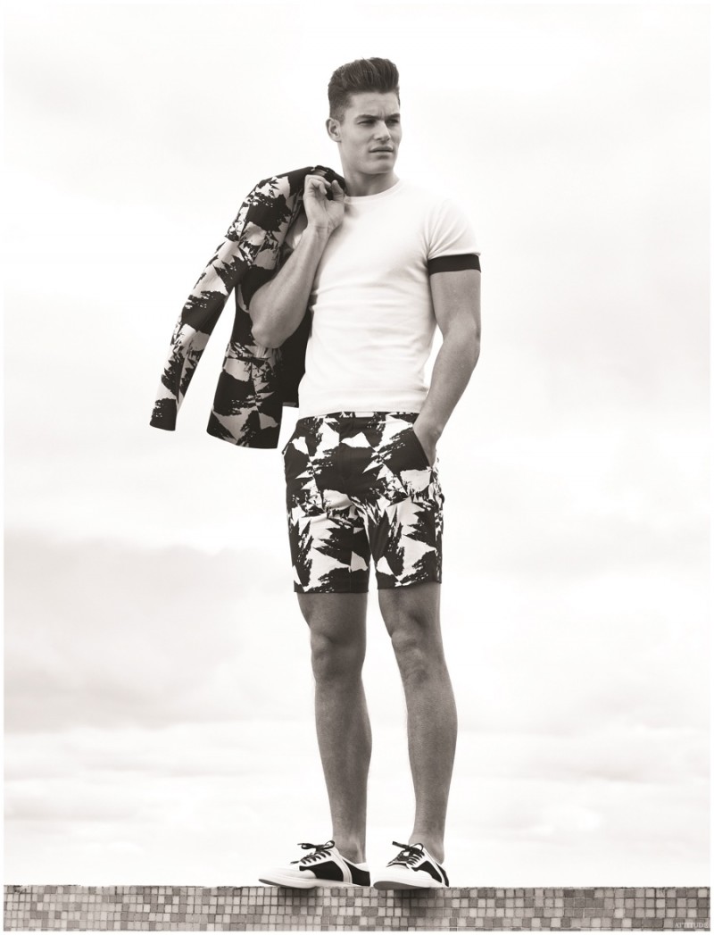 Tyler Maher relaxes outdoors in printed fashions from ASOS, paired with a Zara top.