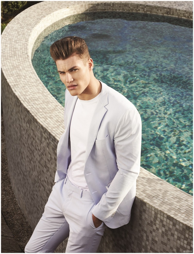 Keeping the color palette neutral, Tyler Maher is chic in a summer suit.