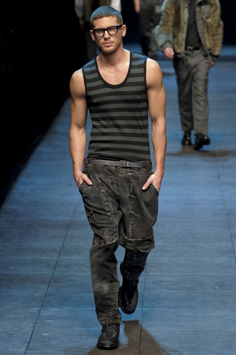 Adam Senn sports a striped tank as he walks for Dolce & Gabbana's fall-winter 2012 show.