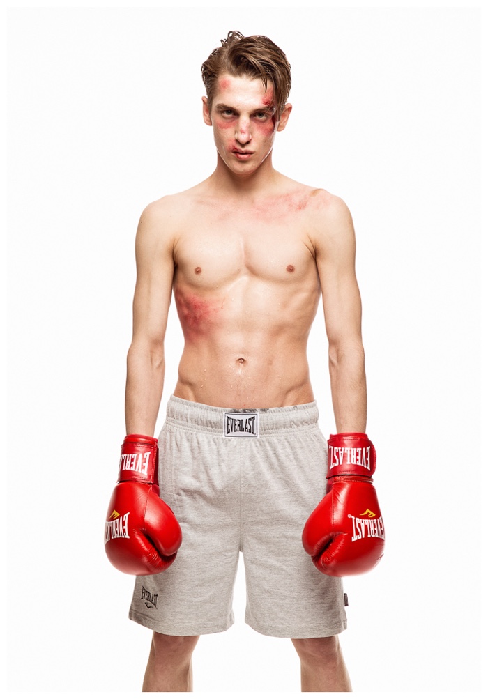 Going shirtless as a boxer, Anatol Modzelewski is battered and bruised.