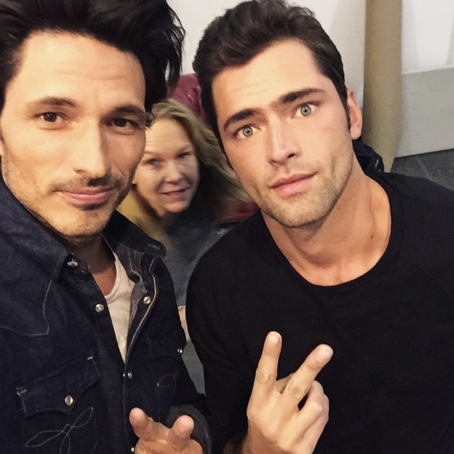 Andres Velencoso Segura and Sean O'Pry pose for an Instagram selfie photobombed by producer Anette Hedin.
