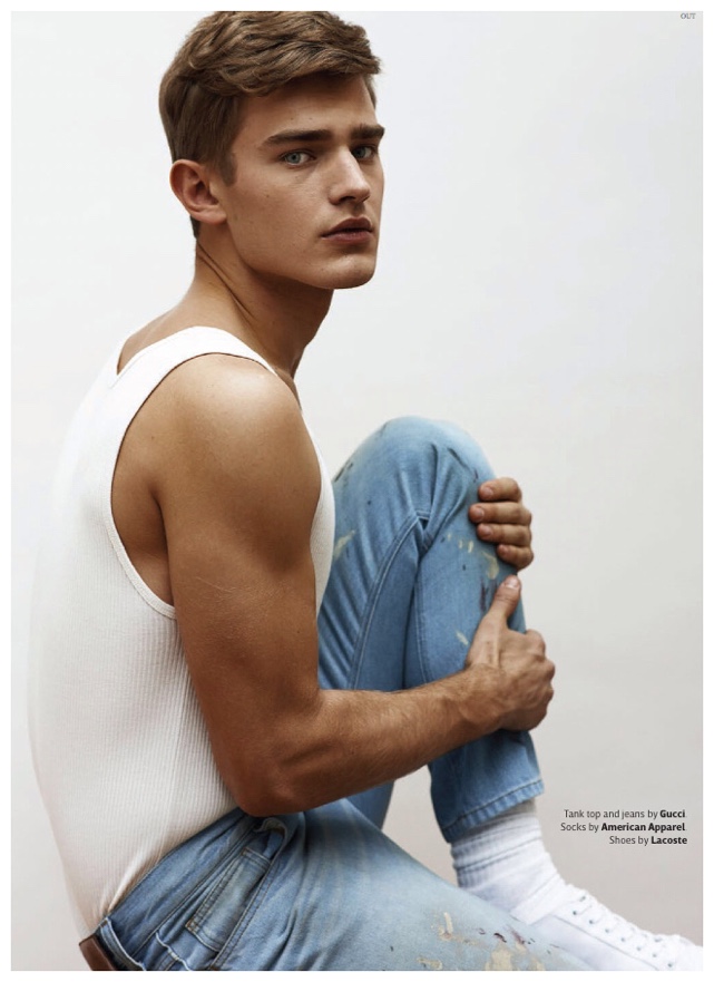 Bo Develius is relaxed in a tank and denim jeans from Gucci.