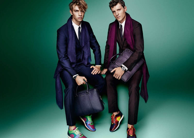 Photographed by Mario Testino for Burberry's spring 2015 campaign, George Barnett and George Le Page accessorize their suits with scarves in the same color scheme.