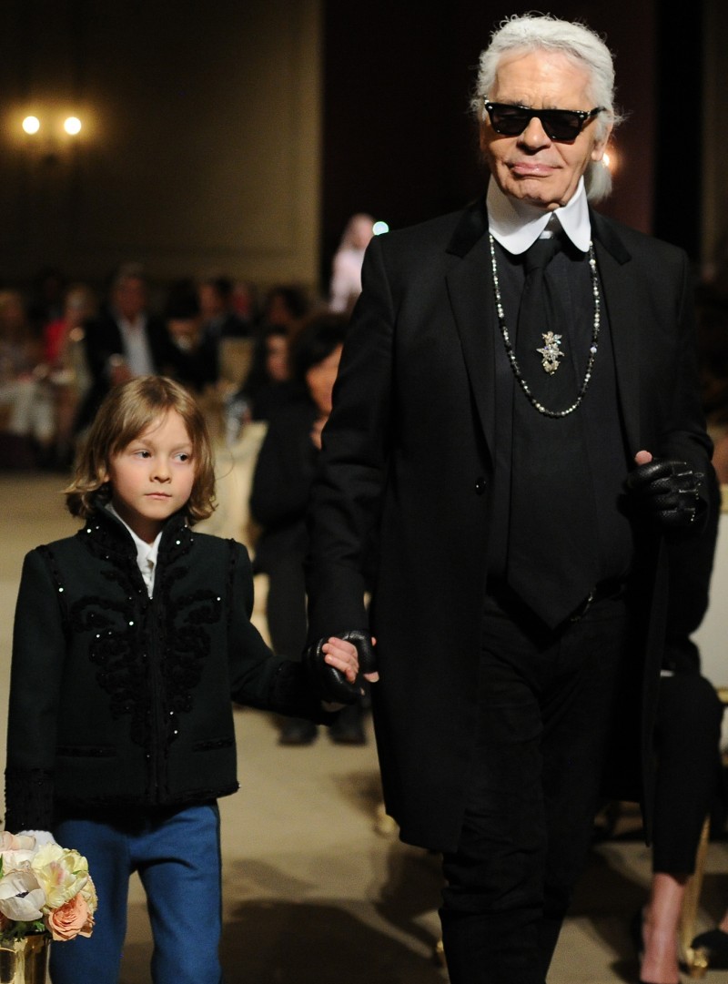 Chanel creative director Karl Lagerfeld makes the final walk with Hudson Kroenig in toll.